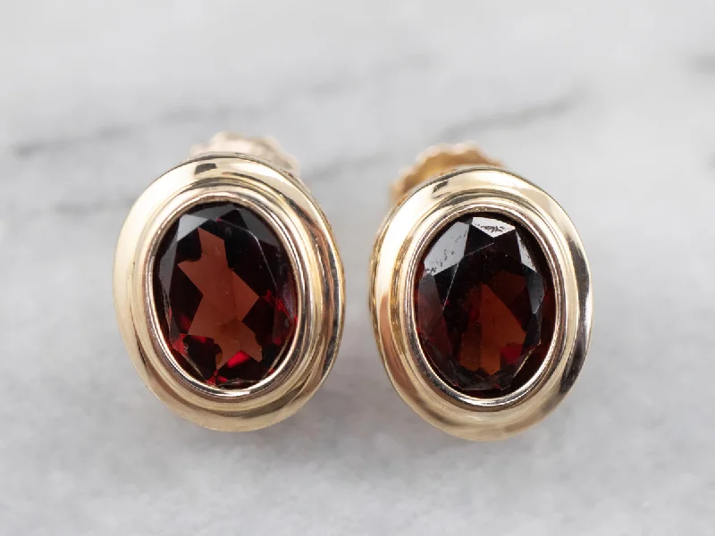 Bezel Set Garnet Stud Earrings in Yellow Gold