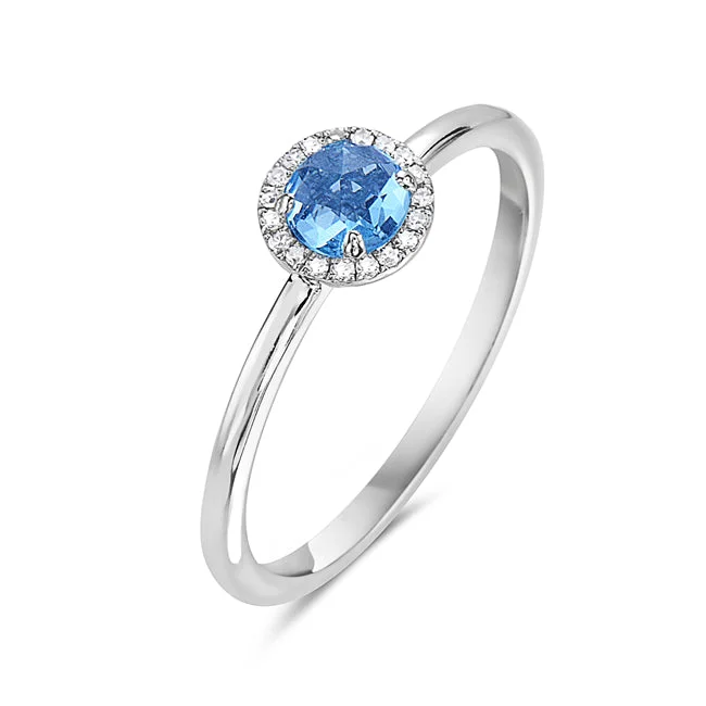 Blue Topaz And Diamond Halo Ring